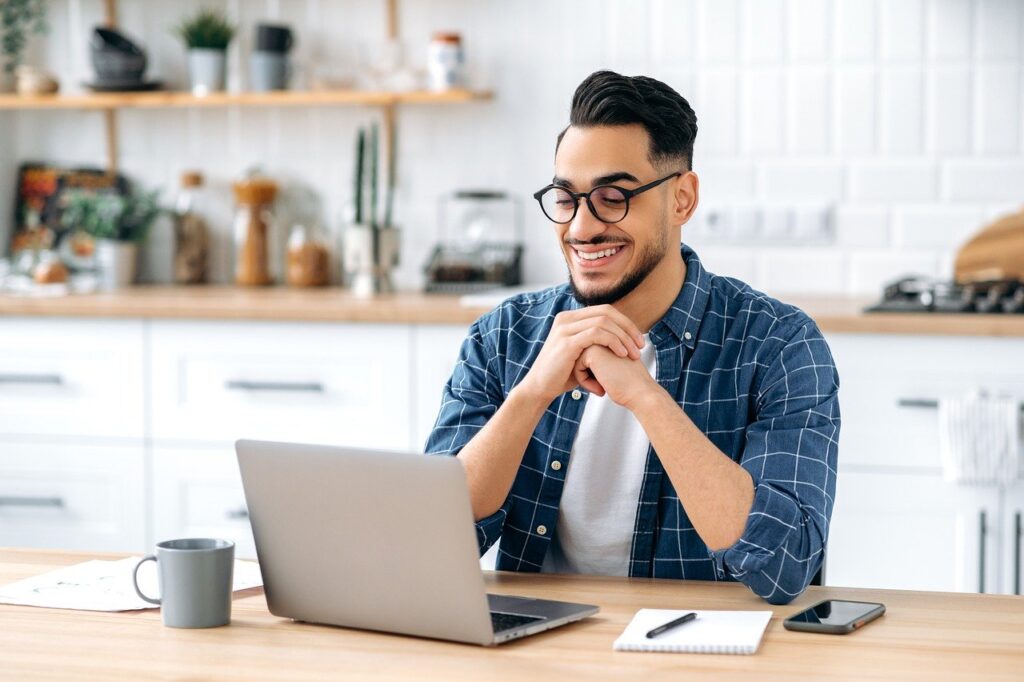 man, laptop, kitchen