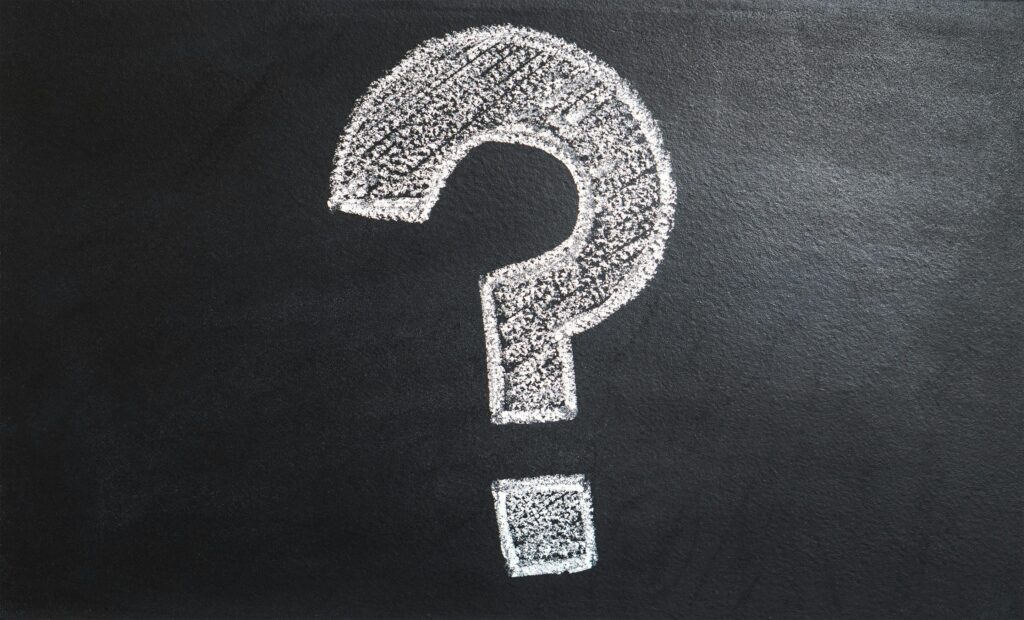 A conceptual image featuring a question mark drawn on a chalkboard, ideal for problem-solving contexts.